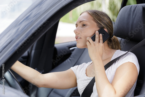 young female driver on the phone © auremar