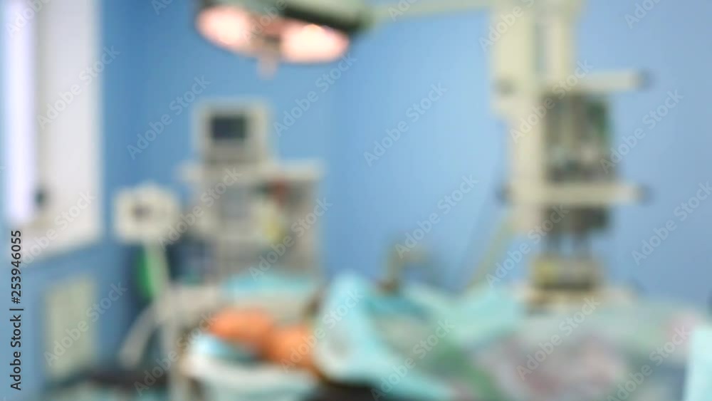 Operation. Preparing for an operation. The patient is on the operating table. Сonsultation of surgeons before surgery Operation. Preparing for an operation. The patient is on the operating table. Сonsultation of surgeons before surgery