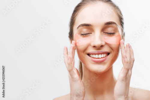 Eyes mask cosmetic patch under woman close eyes