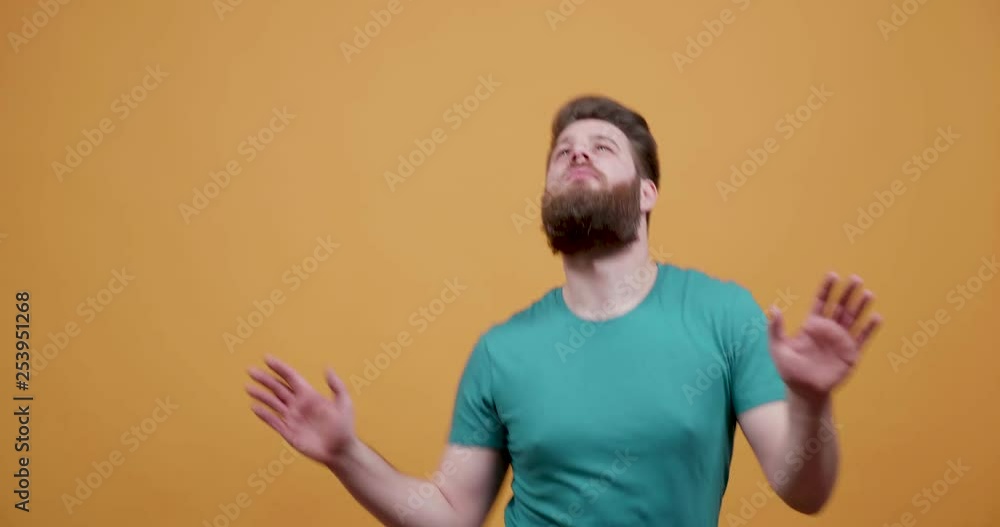 Funny young man with a nice beard dances disco. Very positive man making disco moves as like he is in a club Funny young man with a nice beard dances disco. Very positive man making disco moves as like he is in a club