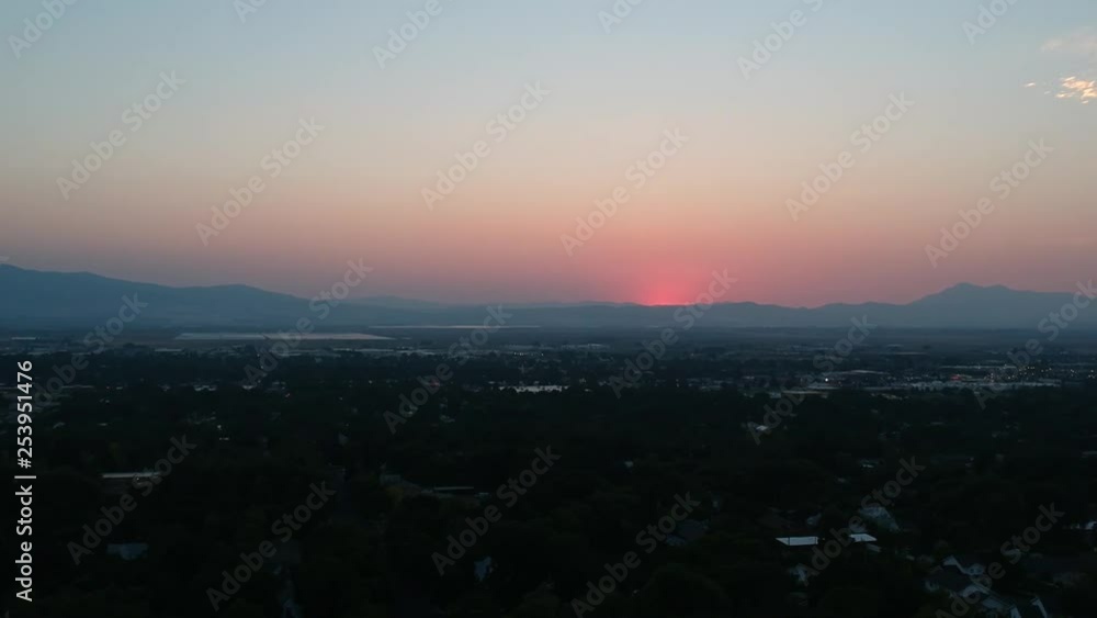 Drone flying towards a smokey sunset in Salt Lake City Utah Drone flying towards a smokey sunset in Salt Lake City Utah