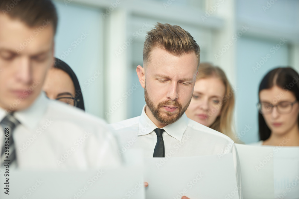 close up.a serious business team examines the documents before the meeting close up.a serious business team examines the documents before the meeting