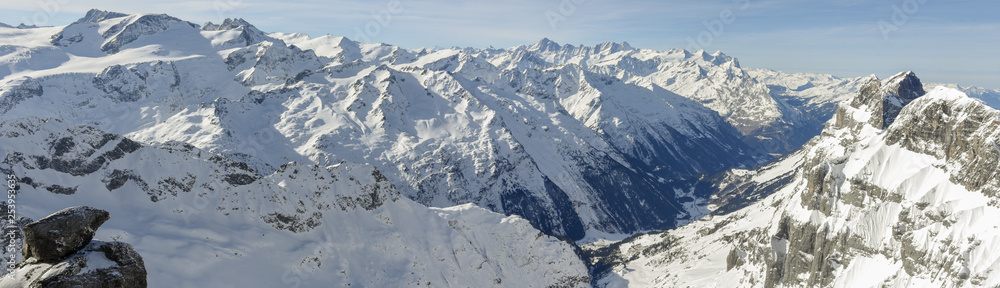 Winter landscape from mount Titlis over Engelberg to the swiss alps