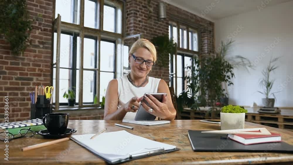 Caucasian businesswoman is working using digital tablet computer, brainstorming creative ideas planning new ideas in office room Caucasian businesswoman is working using digital tablet computer, brainstorming creative ideas planning new ideas in office room