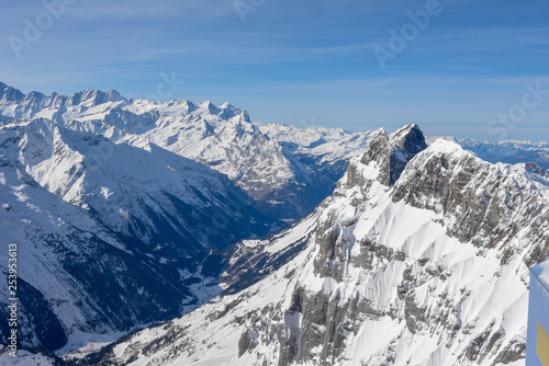 Winter landscape from mount Titlis over Engelberg to the swiss alps