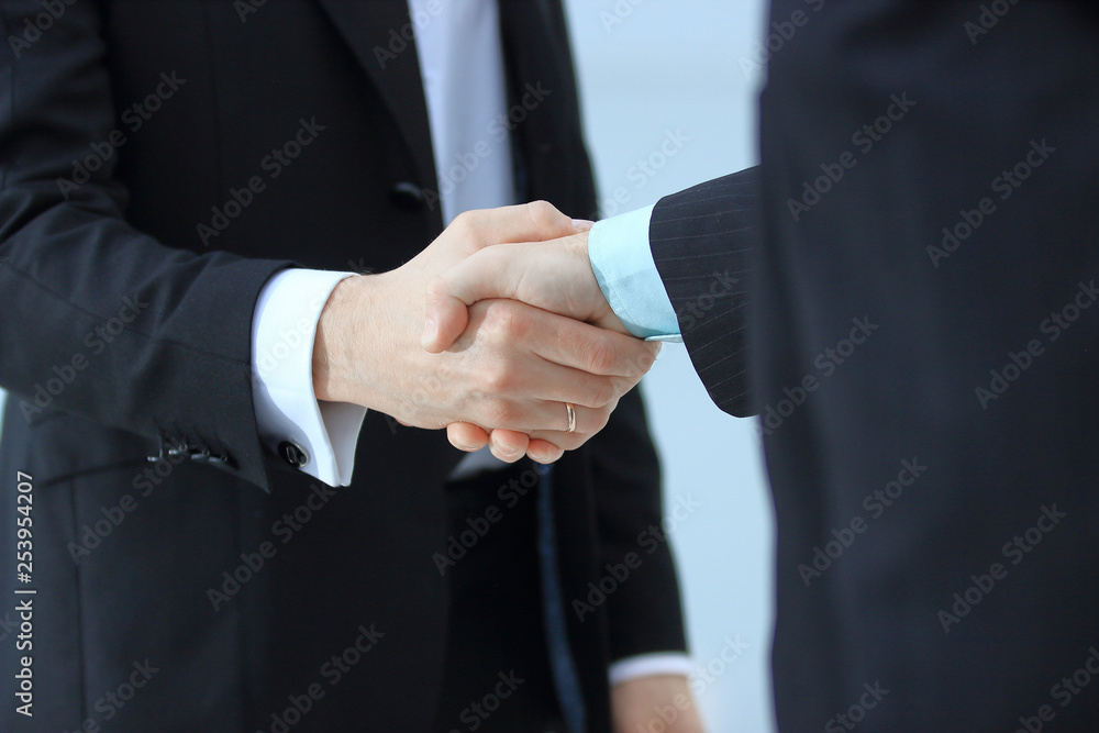 close up.handshake of trading partners on blurred office background close up.handshake of trading partners on blurred office background
