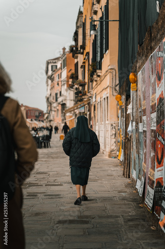 Nun walking on a street