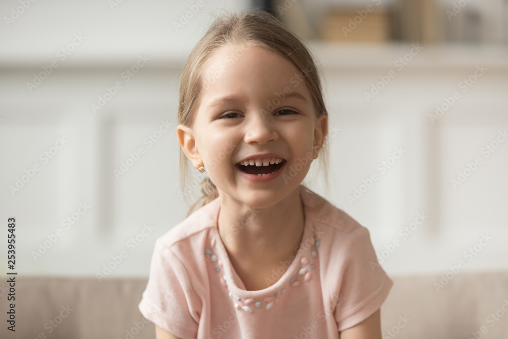 Funny adorable little girl laughing looking at camera, headshot portrait Funny adorable little girl laughing looking at camera, headshot portrait