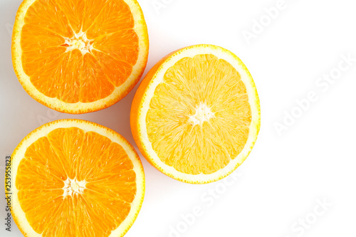 slices of fresh orange on white background