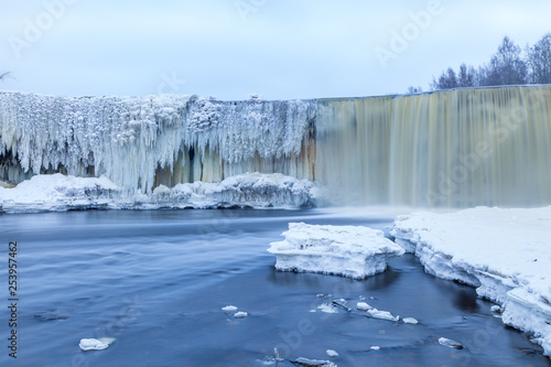 Beautiful frozen waterfall in winter. Jagala, Estonia, Eastern Europe.