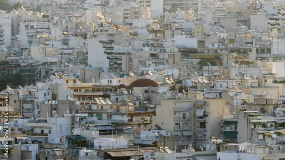 Beautiful early morning in Athen. Shot over the urban city of Athen in Greece. Endless cluster of buildings. Beautiful early morning in Athen. Shot over the urban city of Athen in Greece. Endless cluster of buildings.