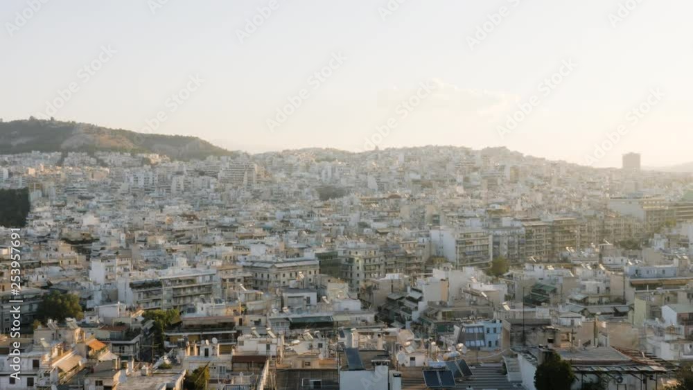 Beautiful early morning in Athen. Wide panning shot over the urban city of Athen in Greece. Beautiful early morning in Athen. Wide panning shot over the urban city of Athen in Greece.
