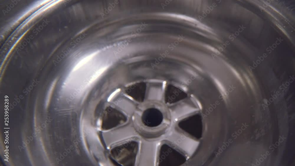Water vortex shot underwater extreme macro close up of a laundry sink ...