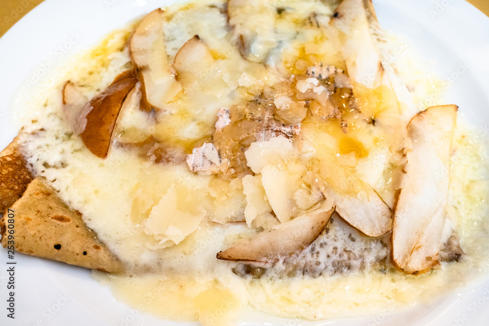 top view crepes with Gorgonzola and pear close up