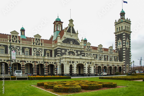Dunedin, New Zealand - September 24th 2016: famous railway station building in Dunedin (Otago) on a cloudy day