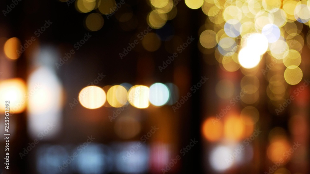 City lights bokeh. Defocused night life background. Out of focus