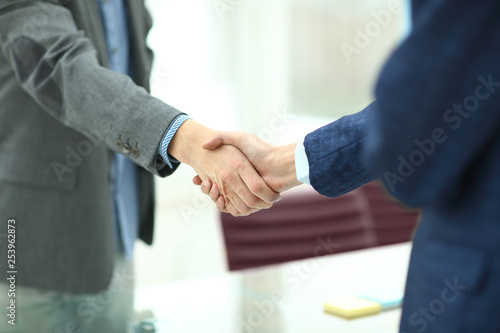 Wallpaper Mural close up.handshake business partners in the workplace in the office Torontodigital.ca