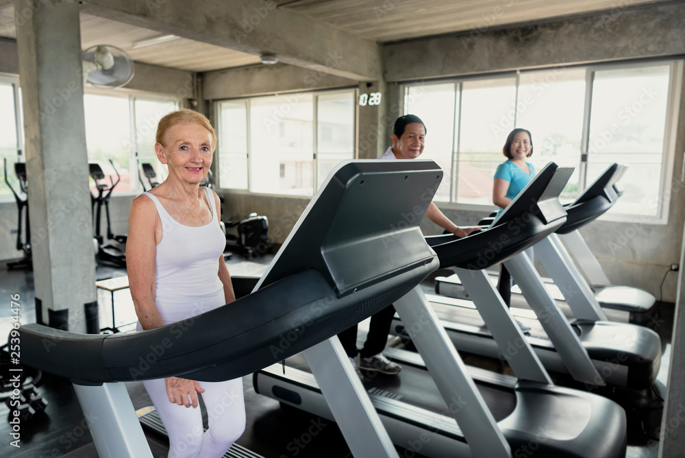 Group friend of senior runner at gym fitness smiling and happy. elderly healthy lifestyle. Group friend of senior runner at gym fitness smiling and happy. elderly healthy lifestyle.