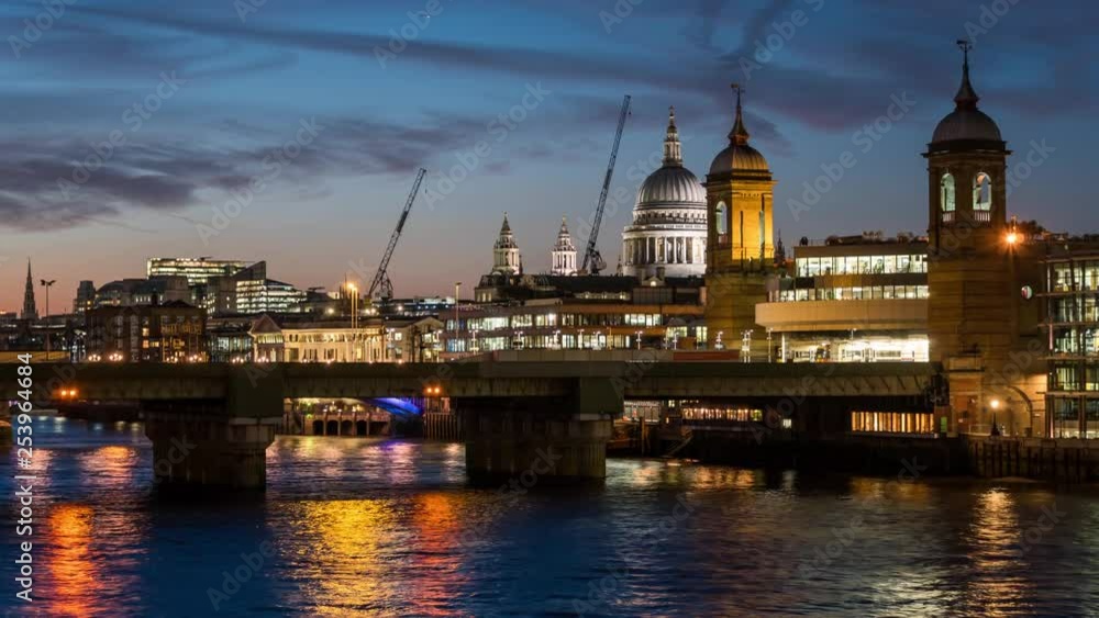 Evening city skyline of London. St Paul's Cathedral, the River Thames and the Southeastern train crossing the river and entering the Cannon Street Station. Evening city skyline of London. St Paul's Cathedral, the River Thames and the Southeastern train crossing the river and entering the Cannon Street Station.