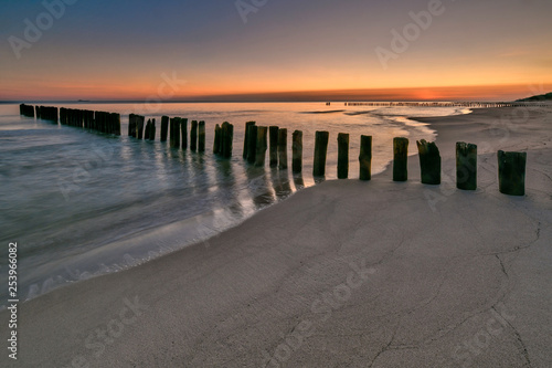 Beautiful sandy beach with a wooden breakwater  Baltic Sea  Poland