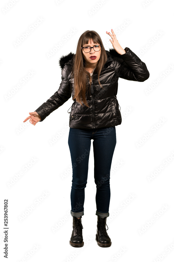 Full-length shot of Woman with glasses making the gesture of madness putting finger on the head Full-length shot of Woman with glasses making the gesture of madness putting finger on the head