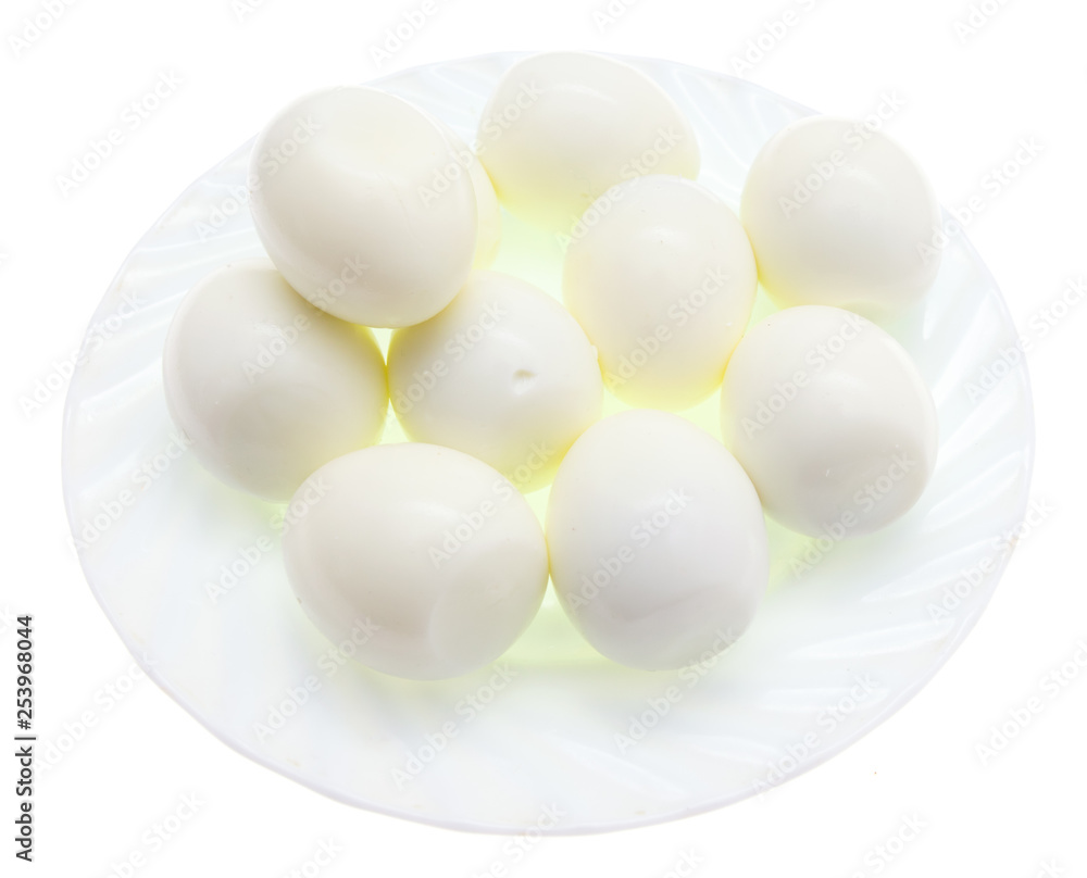 Peeled boiled eggs in a plate on a white background Peeled boiled eggs in a plate on a white background