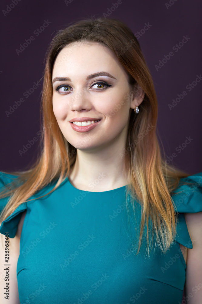 Close-up portrait of a beautiful caucasian girl. Woman 25-30 years old close up in a green dress. Close-up portrait of a beautiful caucasian girl. Woman 25-30 years old close up in a green dress.