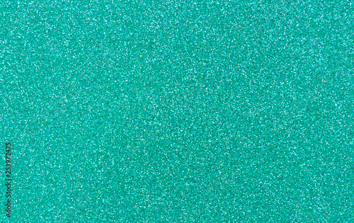 Texture of wrapping paper from  shiny glitter. Defocus, abstract background.