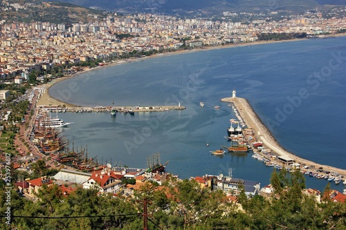 View of the harbor, embankment and pleasure boats in the city of Alanya on the way to the fortress