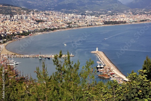 View of the harbor and the city of Alanya from the height of the mountain on a clear windless sunny day