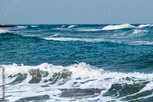Windy weather. Waves on the sea. Sea coast. Skyline. Sunny day. Mediterranean Sea. © Tetiana