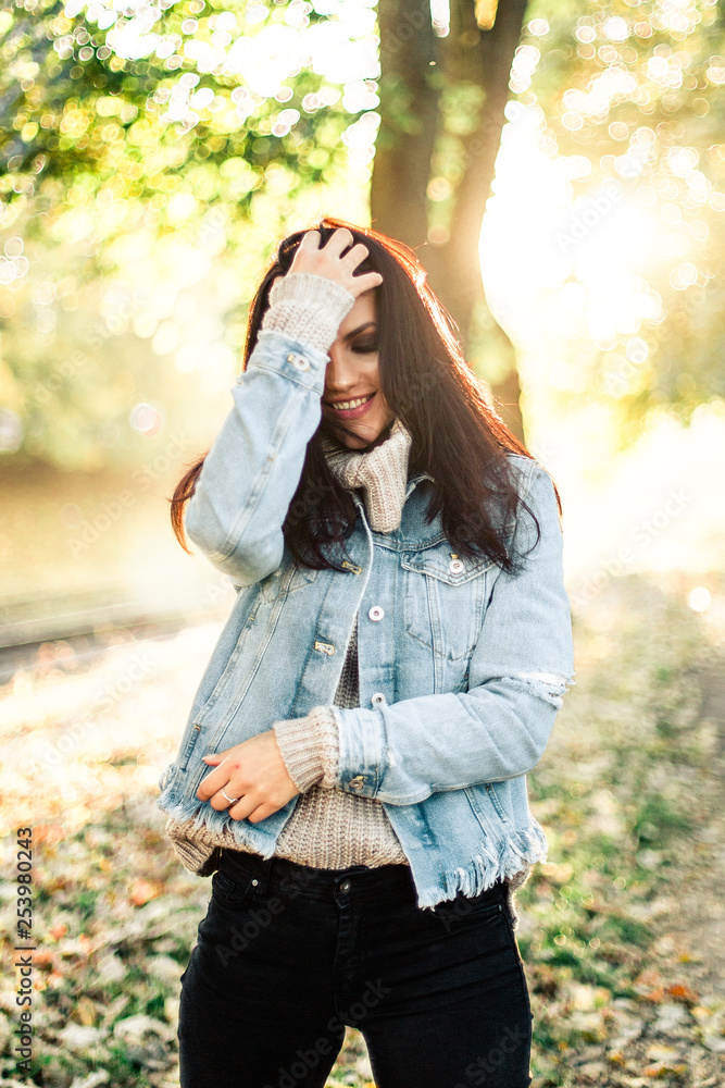 Beautiful model posing for the camera in the park. Beautiful model posing for the camera in the park.