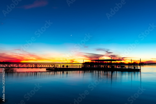 sunset on the lake fishing pier