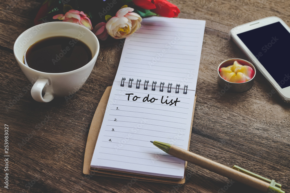 To Do List text on book note with cup of coffee, pen and smartphone. To Do List text on book note with cup of coffee, pen and smartphone.