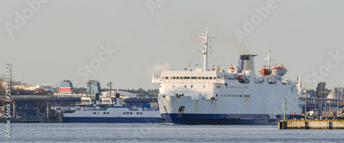PASSENGER-CAR FERRY - The ship departs from port to sea