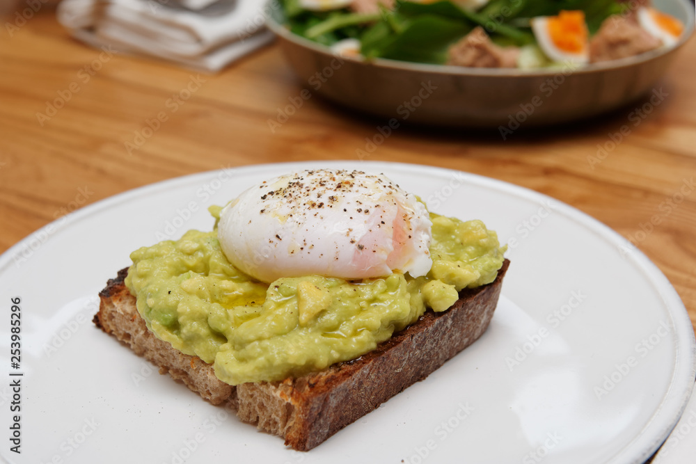 Toast with guacamole and poached egg