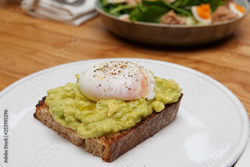 Toast with guacamole and poached egg