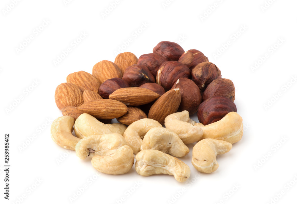 Pile from different kinds of nuts isolated on white background Pile from different kinds of nuts isolated on white background