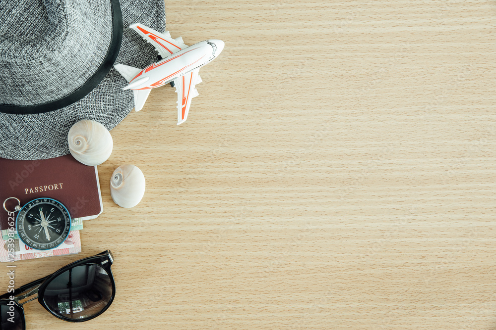 Travel concept background. Passport, compass and accessories on wood table with free space for text. Travel concept background. Passport, compass and accessories on wood table with free space for text.