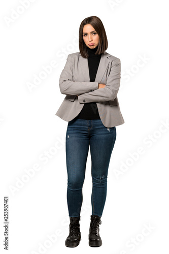 A full-length shot of a Young business woman with sad and depressed expression over isolated white background