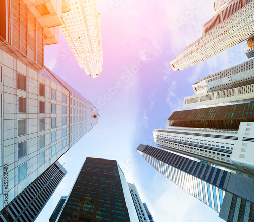 Business buildings looking up view with blue sky. Cityscape downtown and skyscraper modern architecture buildings. Business background.