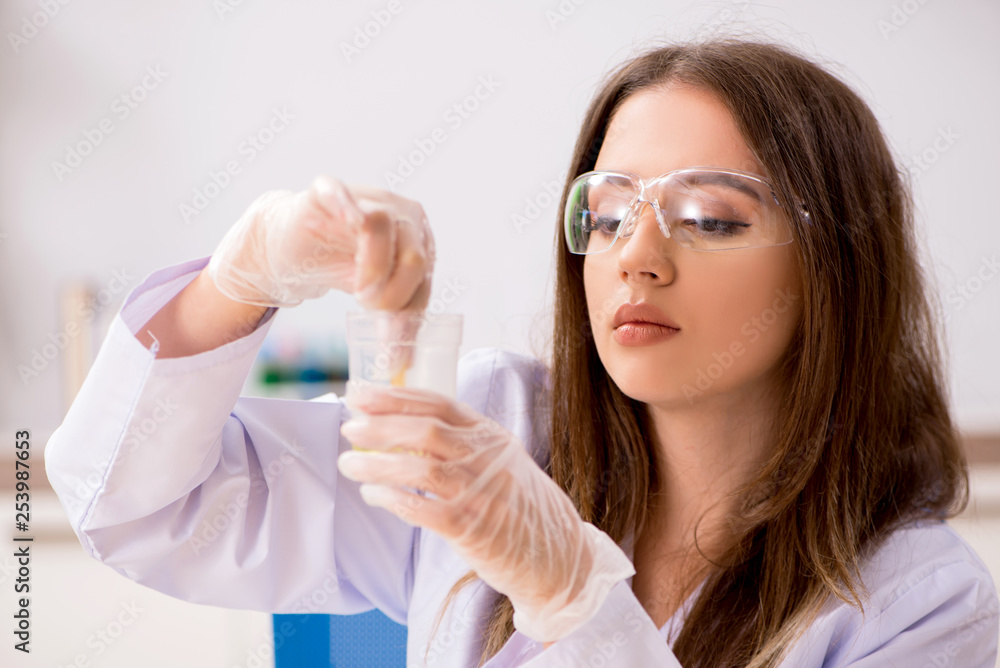 Female beautiful biochemist working in the lab Female beautiful biochemist working in the lab