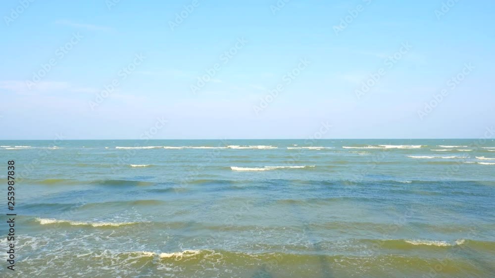 Thailand Andaman Sea Coast Sandy Beach With Waves and Beautiful Blue Sky on Sunny Afternoon with Palms Shadows Thailand Andaman Sea Coast Sandy Beach With Waves and Beautiful Blue Sky on Sunny Afternoon with Palms Shadows