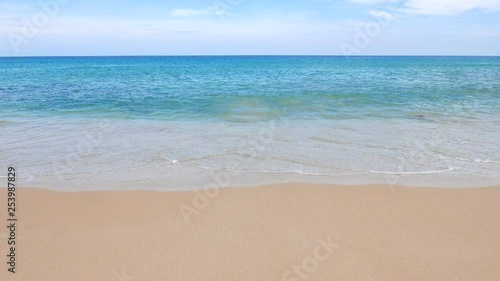 Thailand Andaman Sea Outdoor Coast Sandy Beach With Waves Turquoise Water Beautiful Blue Sky and Sunlight photo