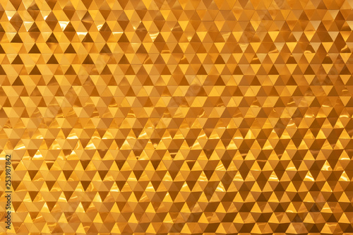 Abstract background from golden brick decorated on wall. Modern wallpaper.