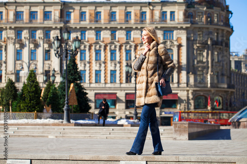 Young beautiful woman in winter coat © Andrey_Arkusha