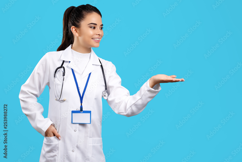 Portrait of beautiful young woman doctor with stethoscope over blue background. Portrait of beautiful young woman doctor with stethoscope over blue background.