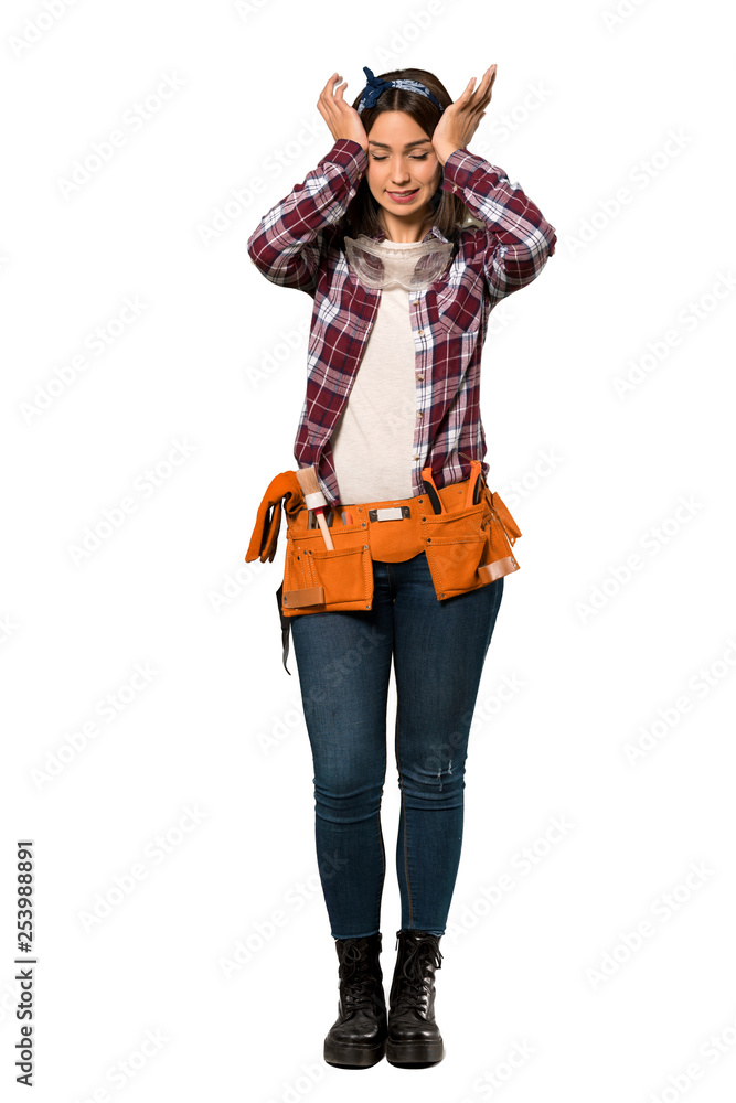 A full-length shot of a Young worker woman frustrated and takes hands on head over isolated white background A full-length shot of a Young worker woman frustrated and takes hands on head over isolated white background