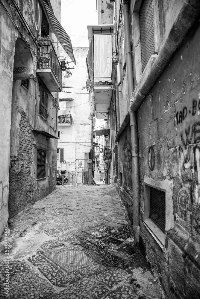 Fototapeta premium Naples, Italy - August 09, 2015 : Narrow streets of Naples, black and white photographs.