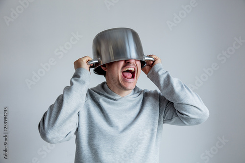 Crying man with pan on head o